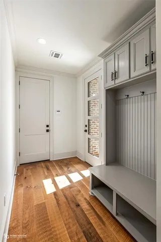 a kitchen with cabinets appliances a sink and a window