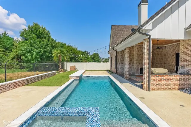 a view of balcony with small yard
