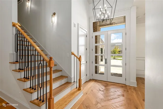 a view of an entryway with wooden floor