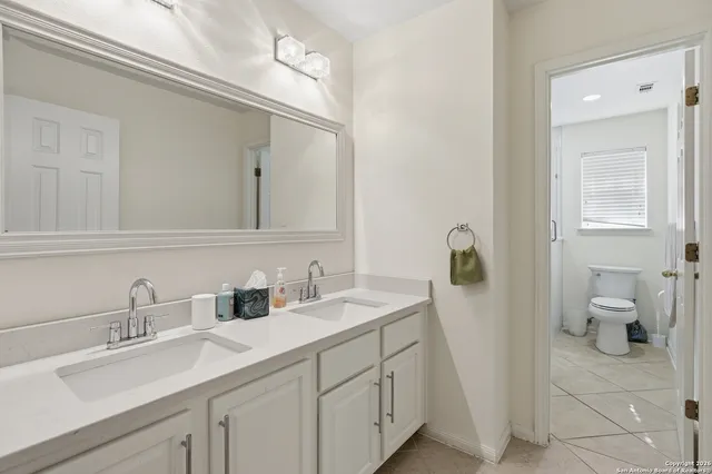 a bathroom with a sink and a toilet