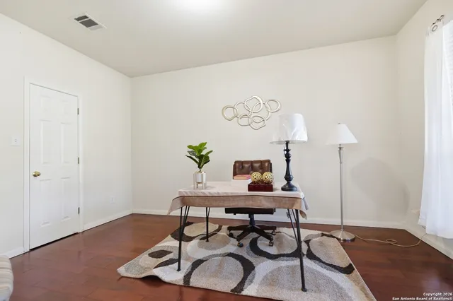 a workspace with furniture and wooden floor
