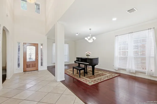 a view of a livingroom with furniture wooden floor and window