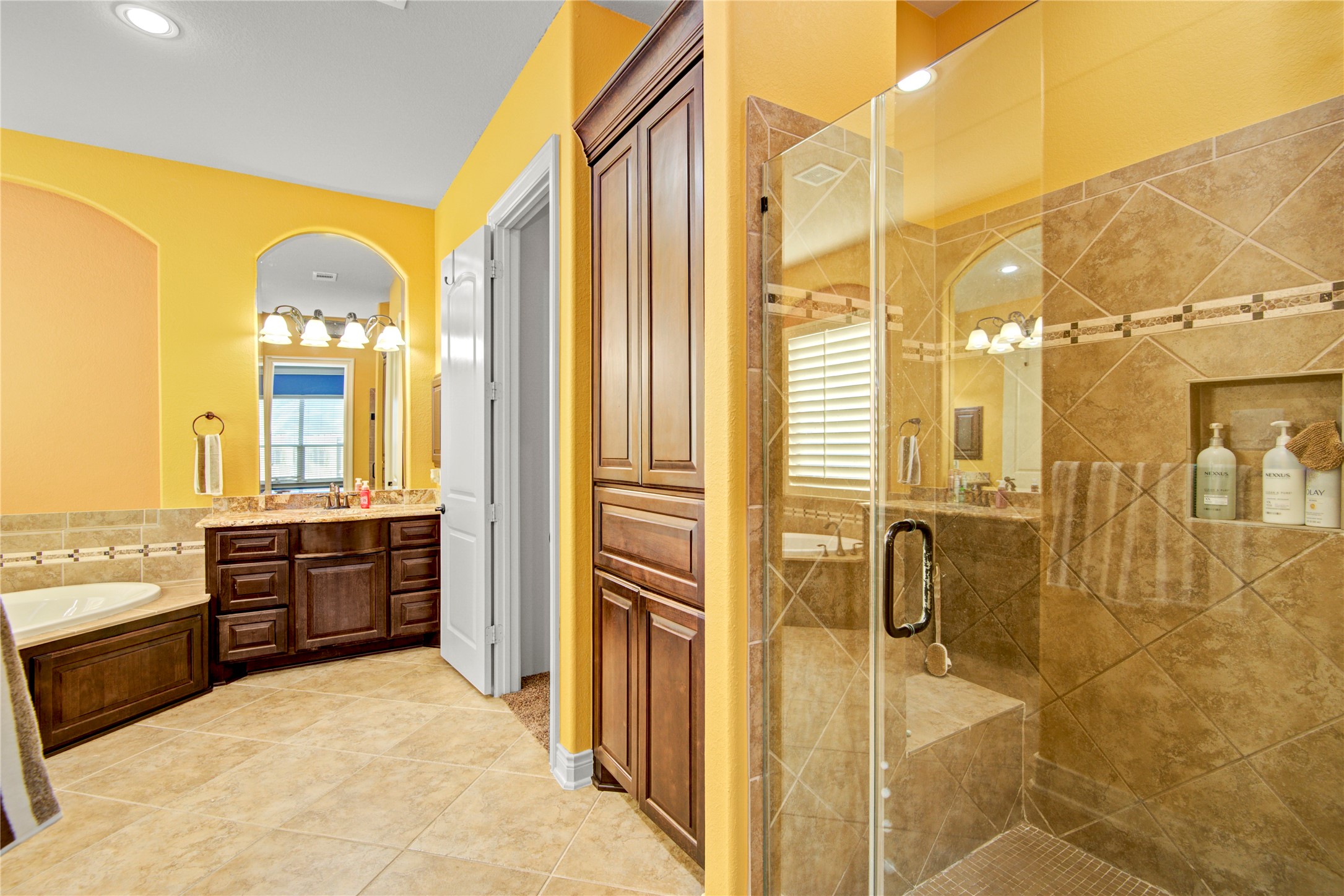 4315 Sanctuary Halls Spring, TX 77388 - Photo 41 of 50 a bathroom with a tub sink shower and mirror