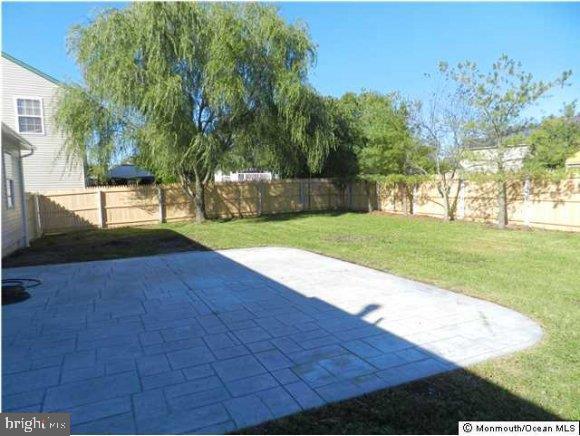 a view of a backyard of the house