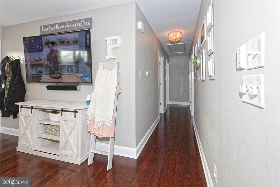 1044 Center Street Tuckerton, NJ 08087 - Photo 19 of 27 a view of a hallway with wooden floor and staircase