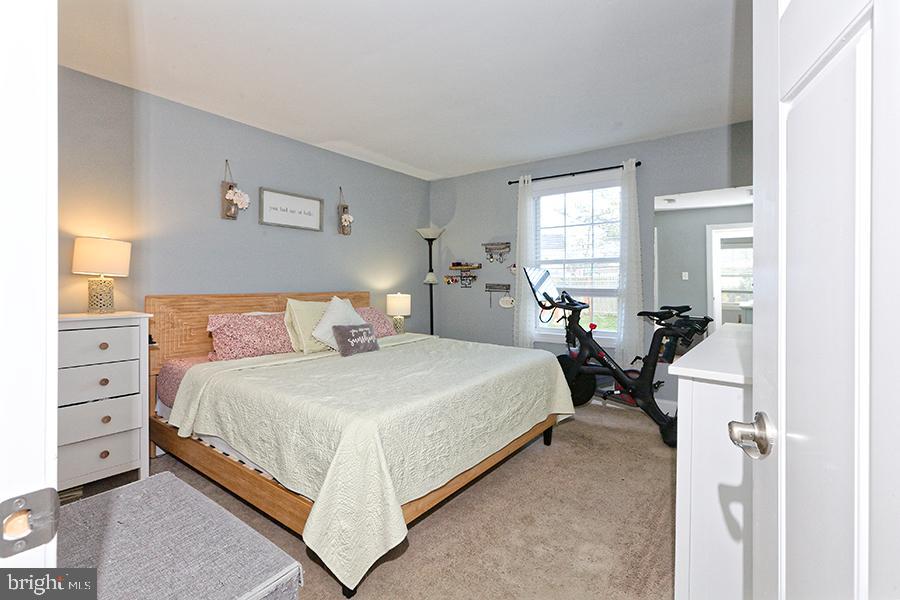 1044 Center Street Tuckerton, NJ 08087 - Photo 25 of 27 a bedroom with a bed and wooden floor
