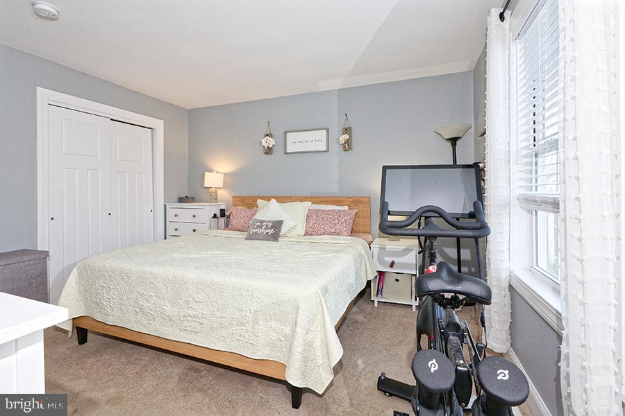 1044 Center Street Tuckerton, NJ 08087 - Photo 26 of 27 a bed room with a bed and a chair