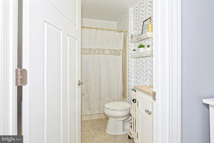 1044 Center Street Tuckerton, NJ 08087 - Photo 27 of 27 a bathroom with a toilet and a shower