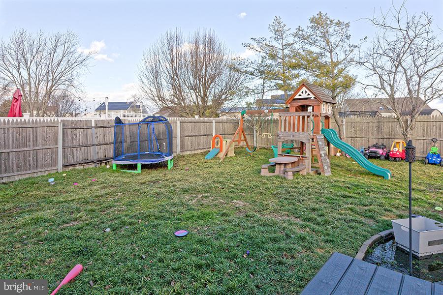 1044 Center Street Tuckerton, NJ 08087 - Photo 10 of 27 a view of a backyard with wooden fence and plants