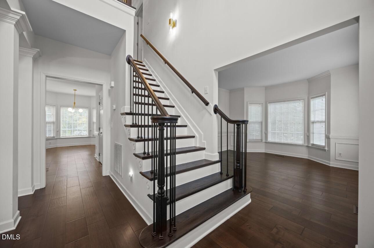 3616 Dewing Drive Raleigh, NC 27616 - Photo 2 of 25 a view of entryway with wooden floor and stairs