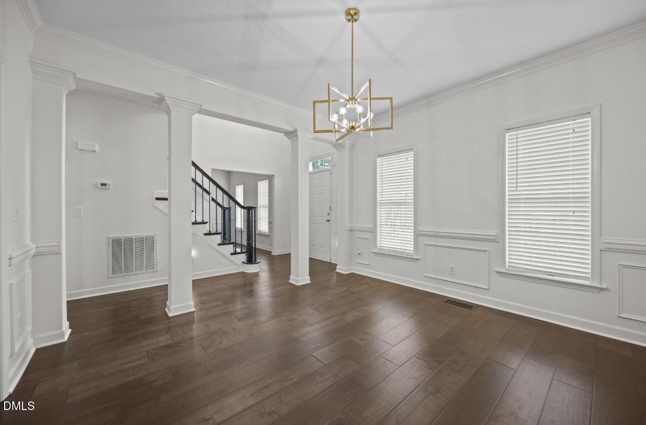 3616 Dewing Drive Raleigh, NC 27616 - Photo 3 of 25 a view of empty room with wooden floor and window