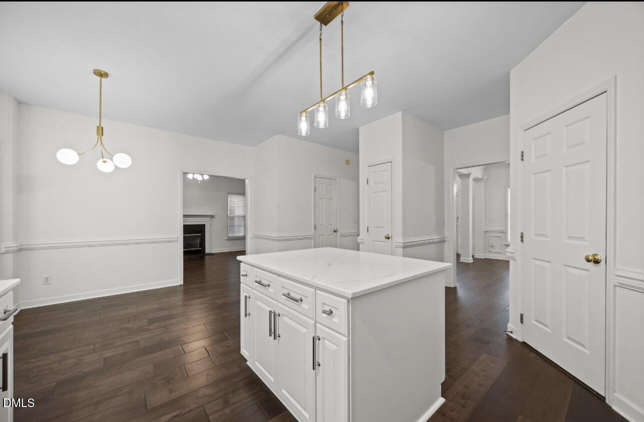 3616 Dewing Drive Raleigh, NC 27616 - Photo 8 of 25 a view of a kitchen island a sink dishwasher with wooden floor