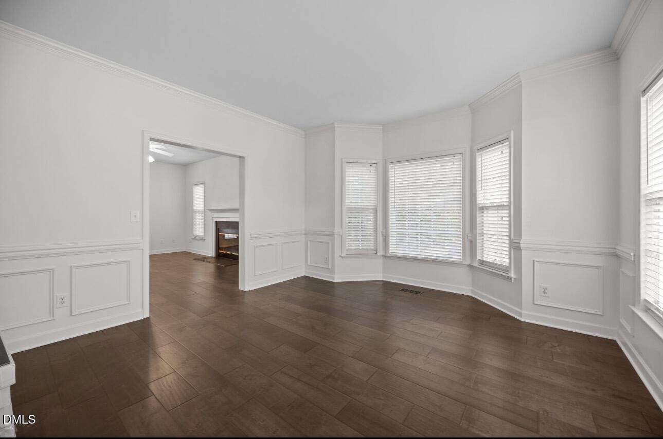 3616 Dewing Drive Raleigh, NC 27616 - Photo 9 of 25 wooden floor in an empty room with a window