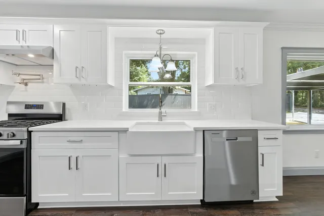a view of kitchen with wooden floor and window