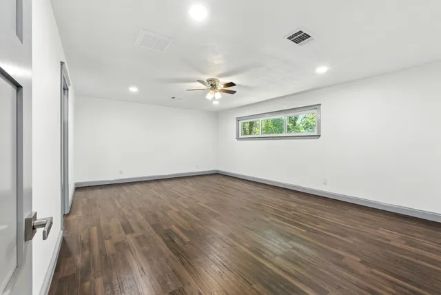 a bathroom with a double vanity sink and mirror