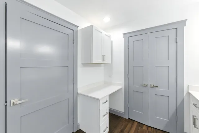 a bathroom with double sink and a mirror