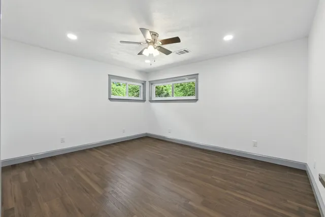 a bathroom with a tub sink and toilet