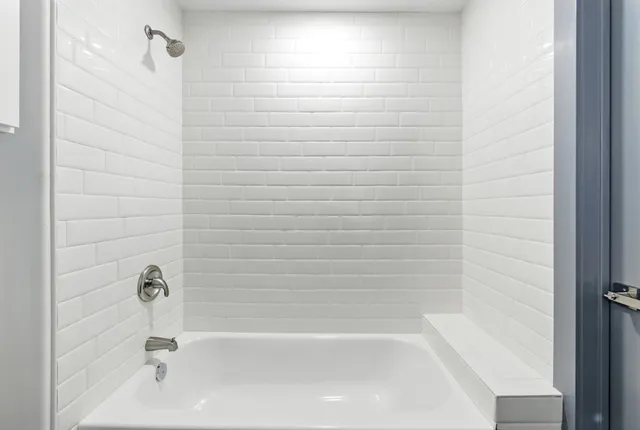 a bathroom with a double vanity sink and mirror
