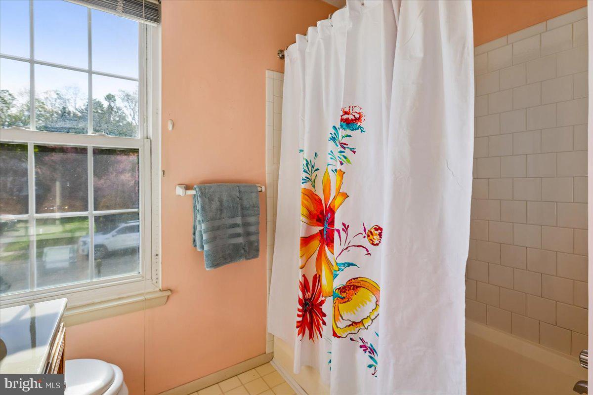 5614 Cliff Side Court Baltimore, MD 21225 - Photo 15 of 28 view with painting on the wall and small window