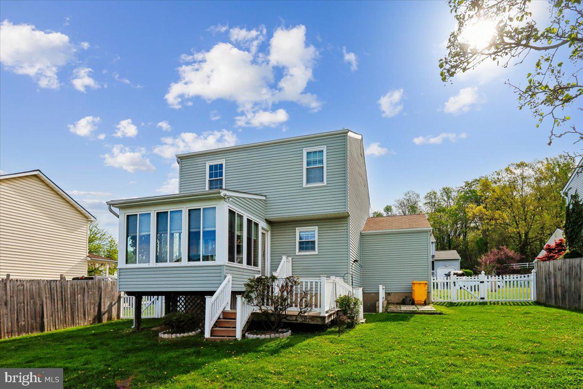 5614 Cliff Side Court Baltimore, MD 21225 - Photo 17 of 28 a front view of house with yard and outdoor seating