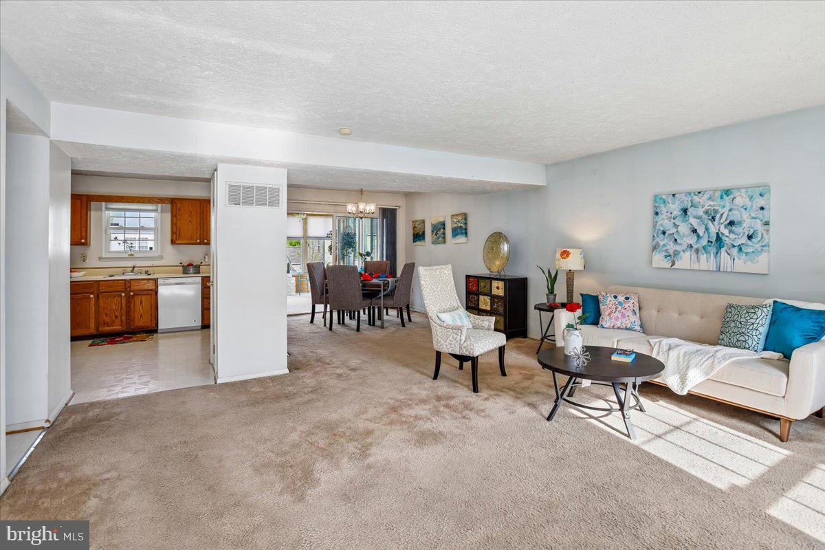 5614 Cliff Side Court Baltimore, MD 21225 - Photo 3 of 28 a living room with furniture and a fireplace