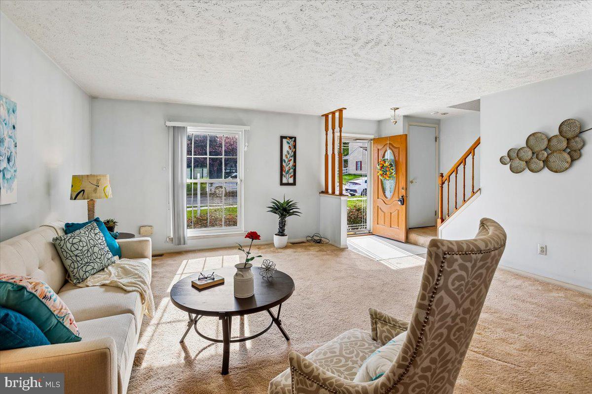 5614 Cliff Side Court Baltimore, MD 21225 - Photo 4 of 28 a living room with furniture and a large window