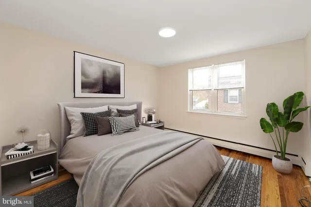 a bedroom with bed window and couch