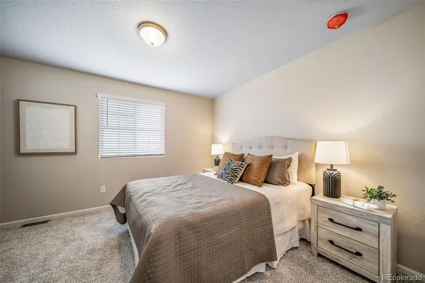 a bedroom with bed and window