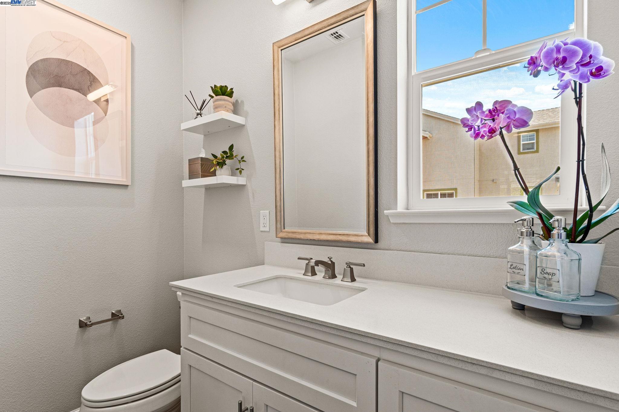 849 Tranquility Circle, Unit 3 Livermore, CA 94551 - Photo 13 of 60 a bathroom with a sink mirror and vanity