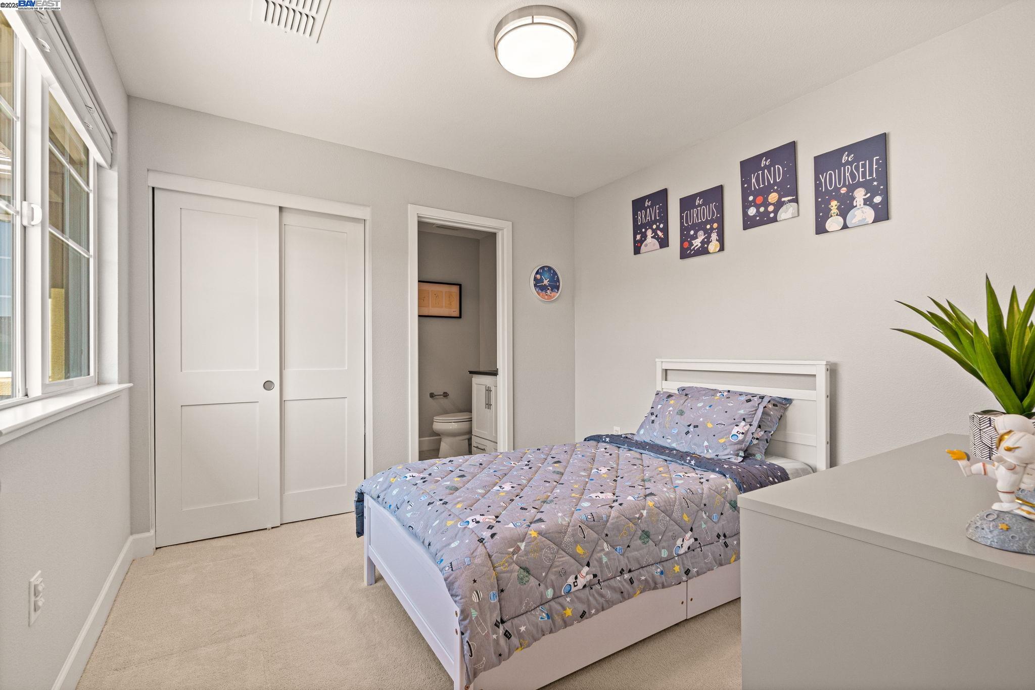 849 Tranquility Circle, Unit 3 Livermore, CA 94551 - Photo 22 of 60 a bedroom with a bed and a window