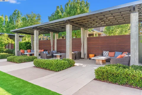 a view of a backyard with sitting area