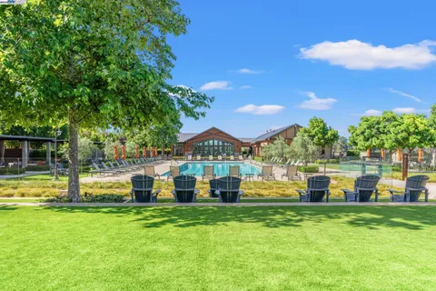 a view of a chairs and table in the patio