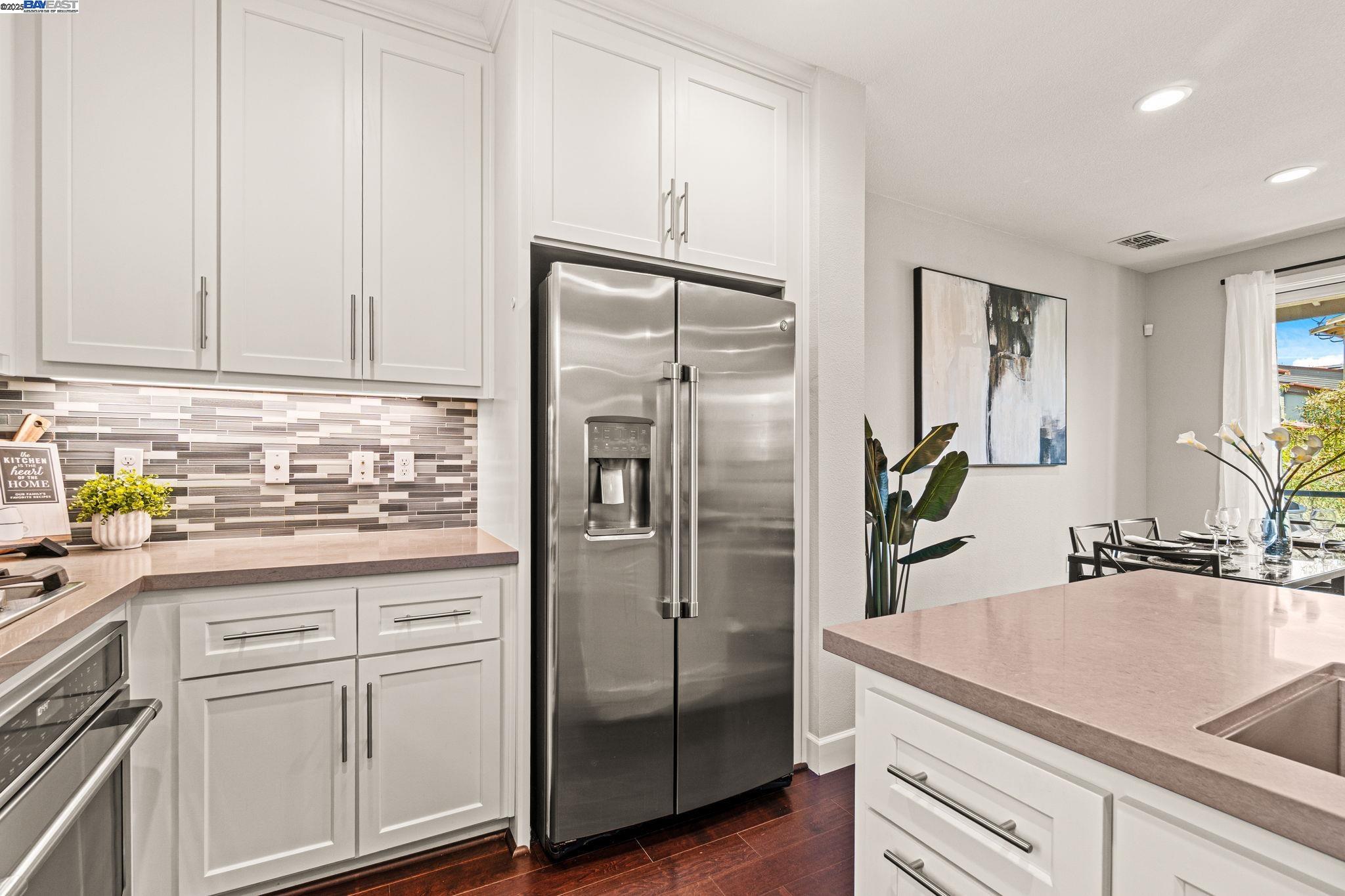 849 Tranquility Circle, Unit 3 Livermore, CA 94551 - Photo 9 of 60 a kitchen with a refrigerator and a sink