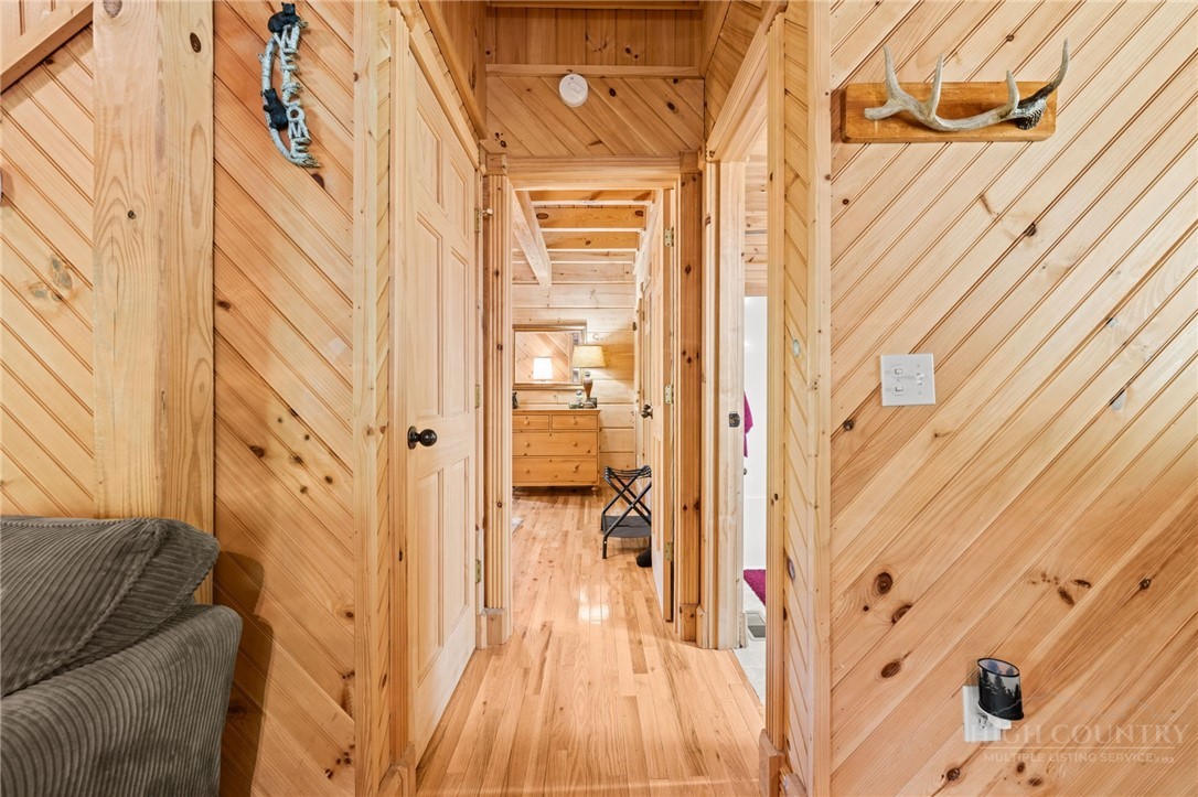 613 Silas Creek Road Lansing, NC 28643 - Photo 25 of 40 a view of a entryway with wooden floor and a glass door