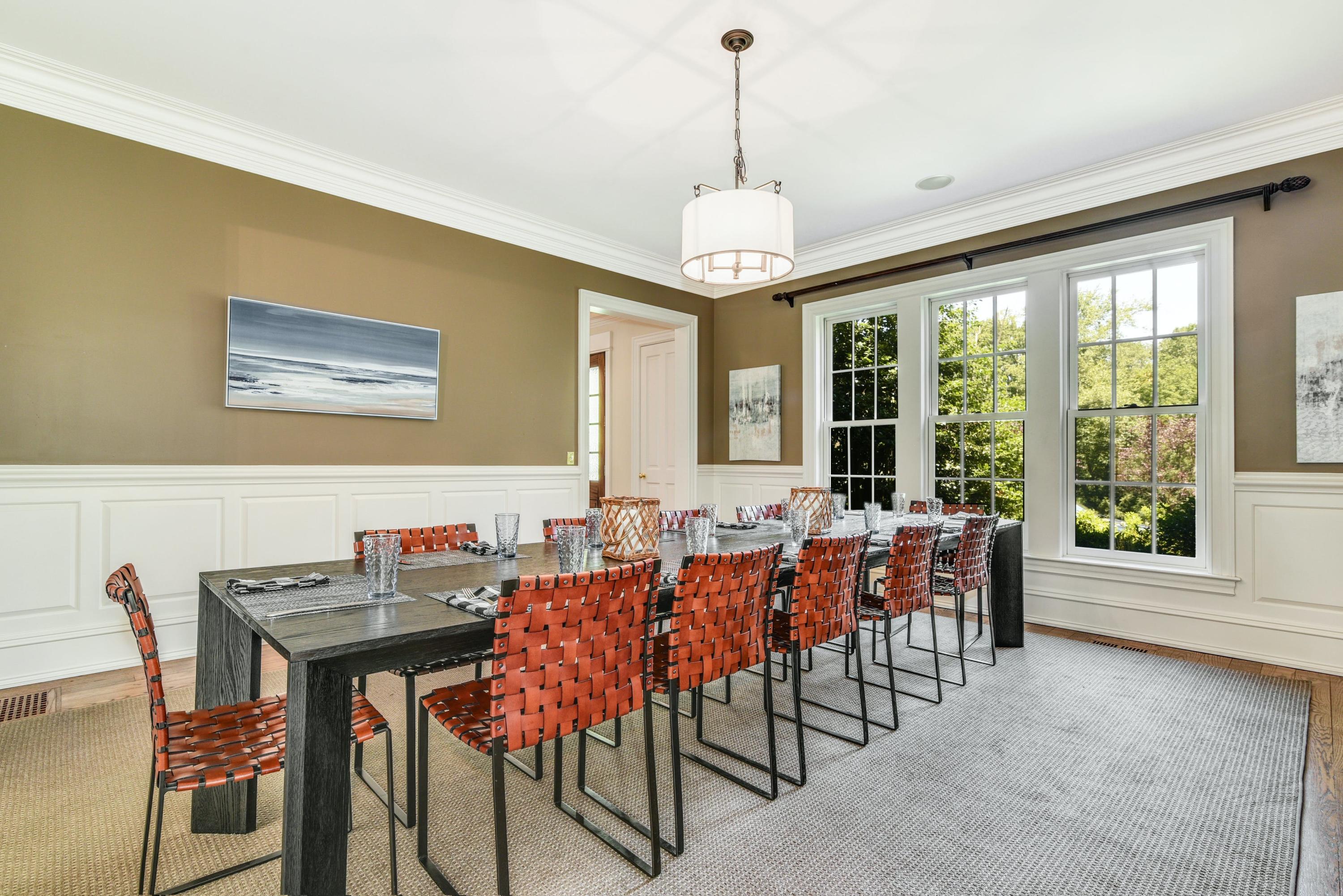 910 Smith Ridge Road New Canaan, CT 06840 - Photo 11 of 40 a view of a dining room with furniture window and outside view