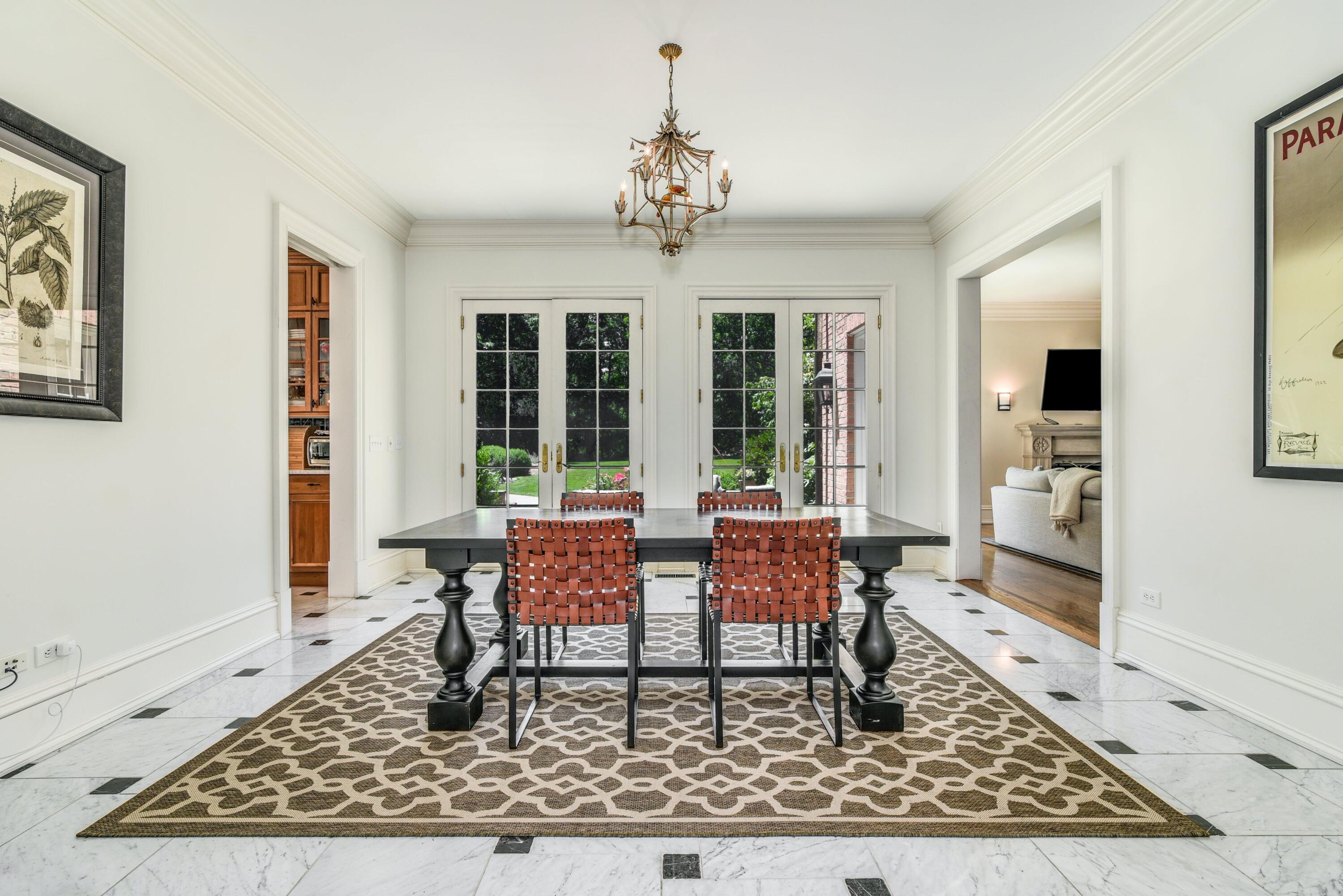 910 Smith Ridge Road New Canaan, CT 06840 - Photo 13 of 40 a dining room with wooden floor and large window