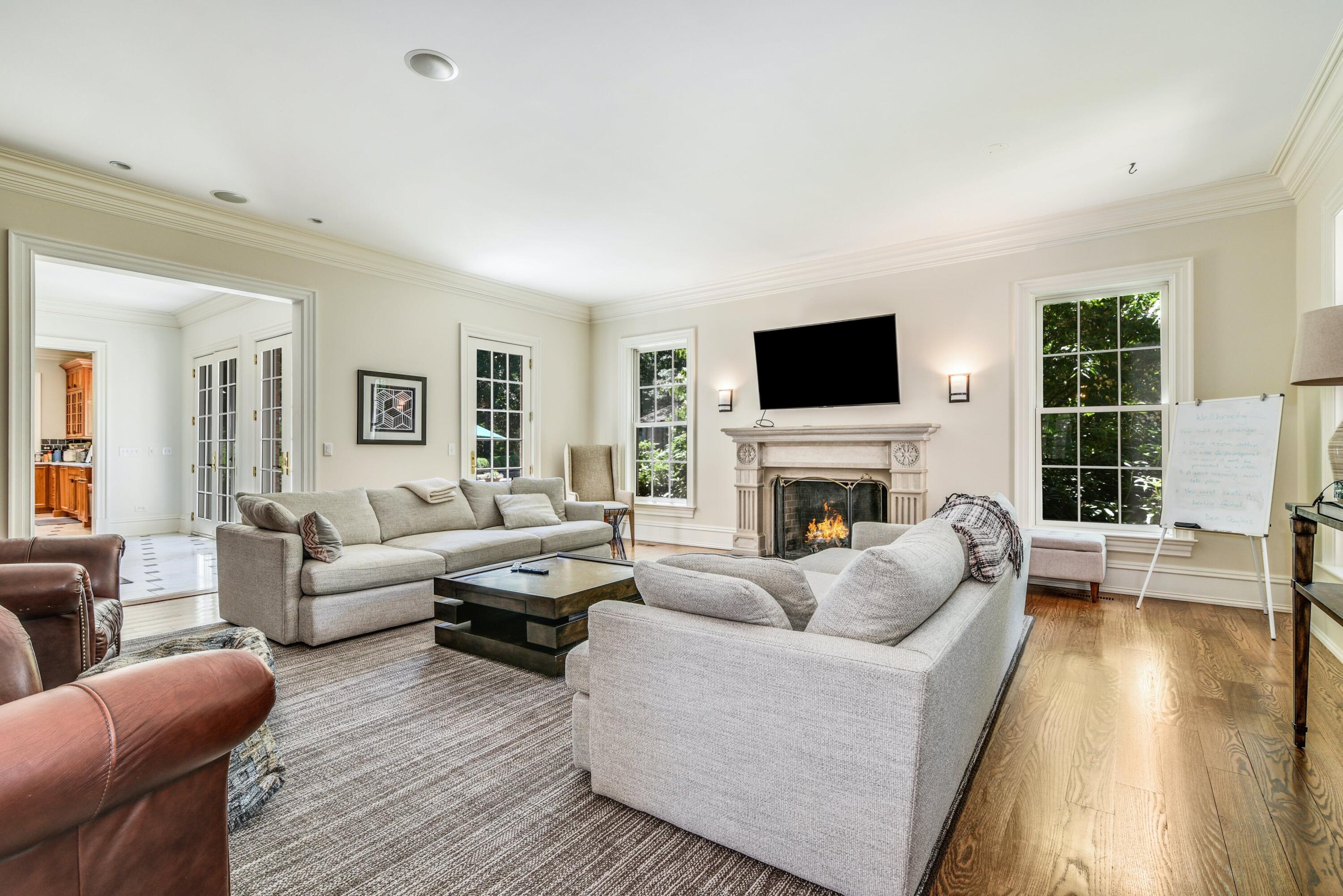 910 Smith Ridge Road New Canaan, CT 06840 - Photo 14 of 40 a living room with fireplace furniture and a flat screen tv