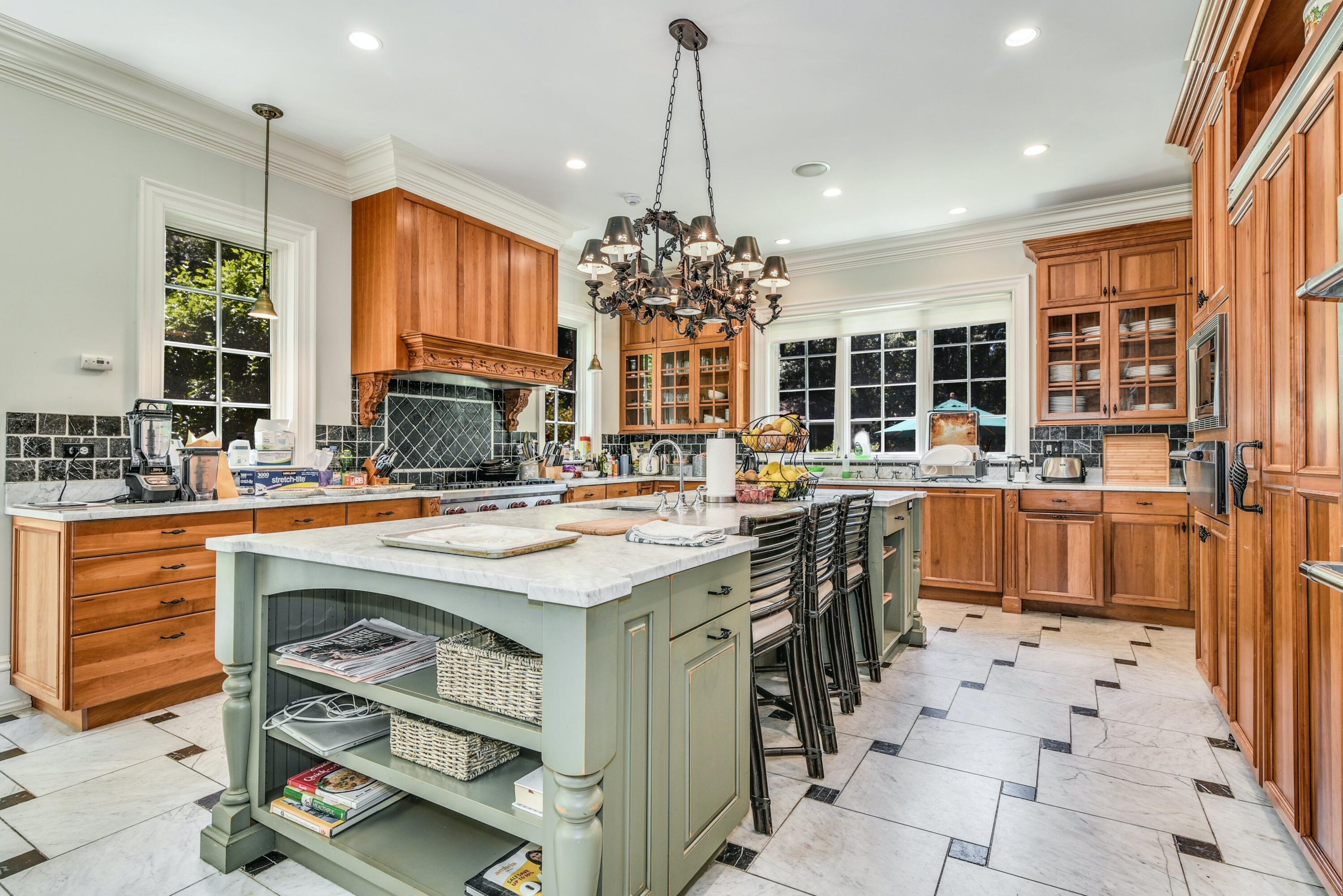 910 Smith Ridge Road New Canaan, CT 06840 - Photo 15 of 40 a kitchen with a sink stove and cabinets