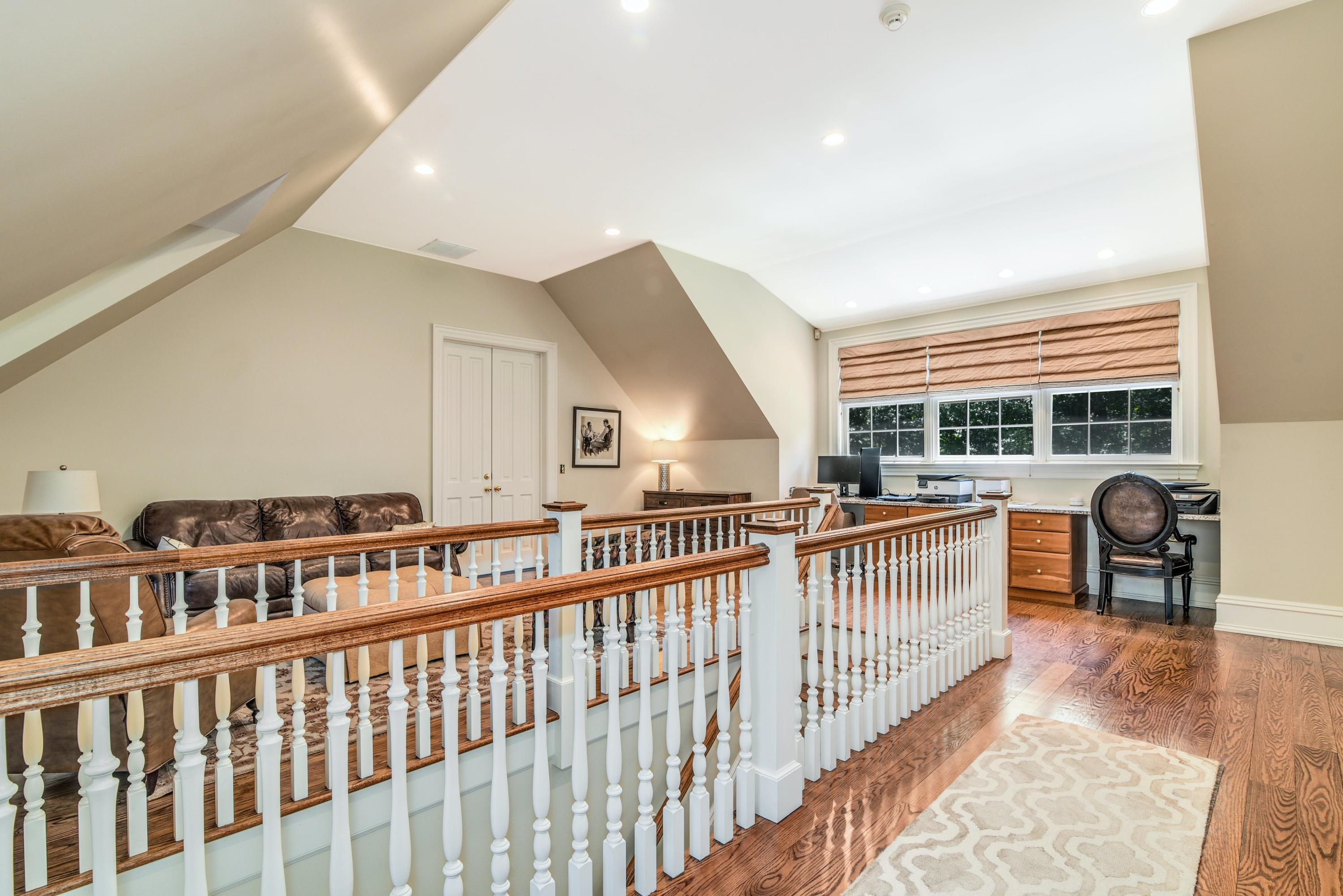 910 Smith Ridge Road New Canaan, CT 06840 - Photo 18 of 40 a view of a kitchen with dining room and wooden floor
