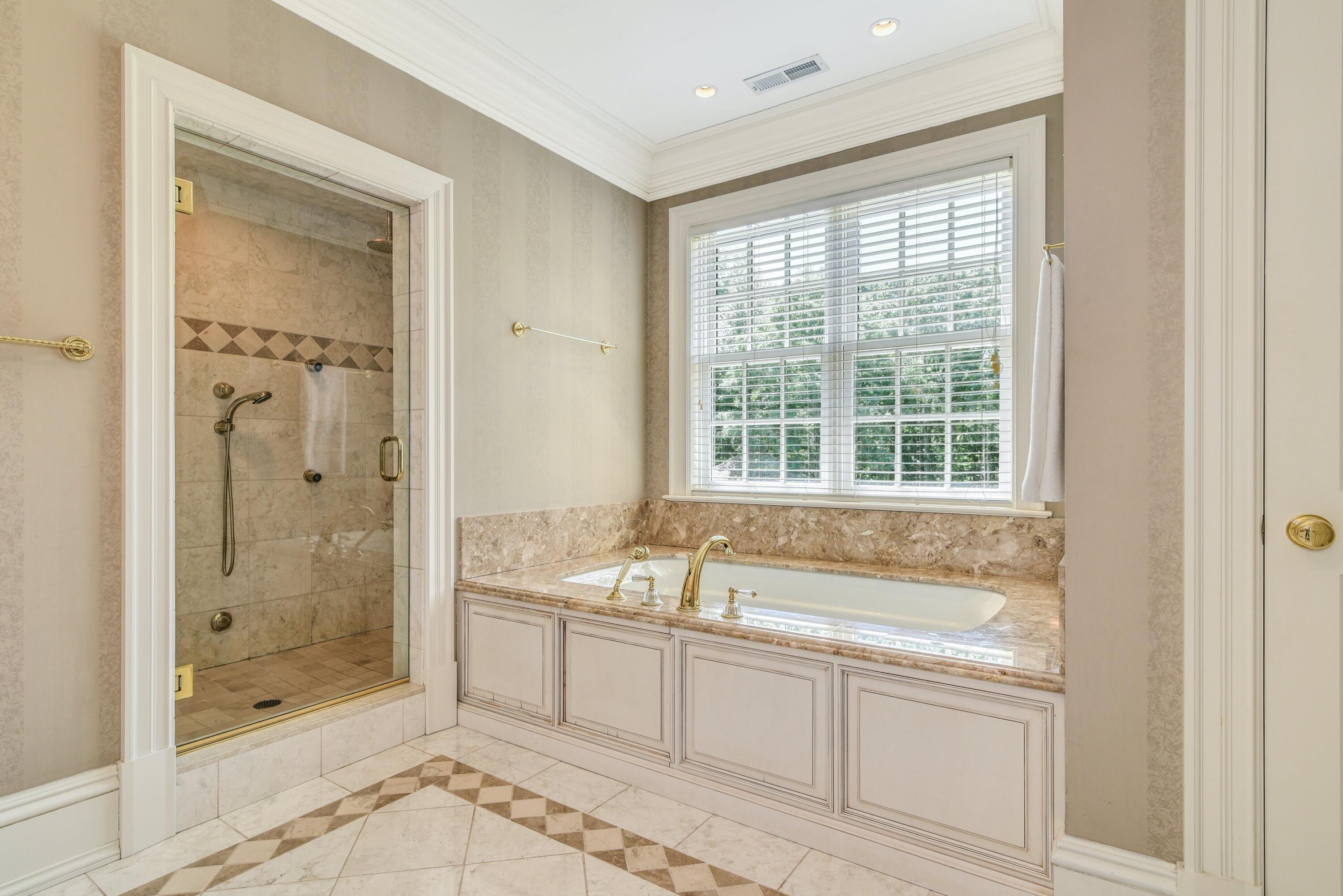 910 Smith Ridge Road New Canaan, CT 06840 - Photo 22 of 40 a spacious bathroom with sink shower and a mirror