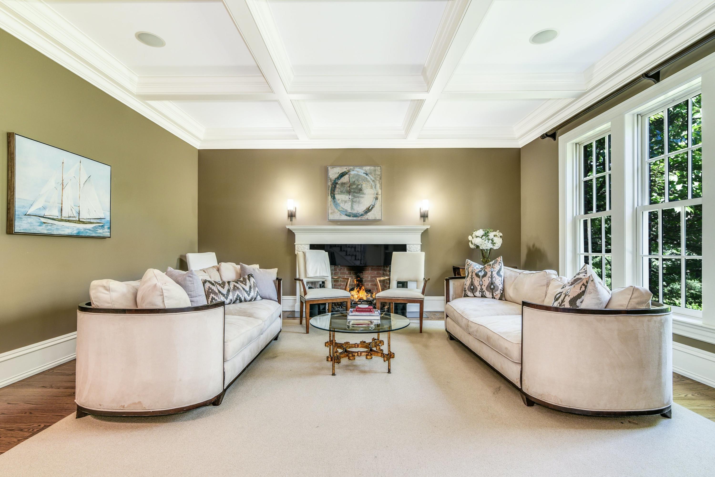 910 Smith Ridge Road New Canaan, CT 06840 - Photo 8 of 40 a living room with furniture and a fireplace