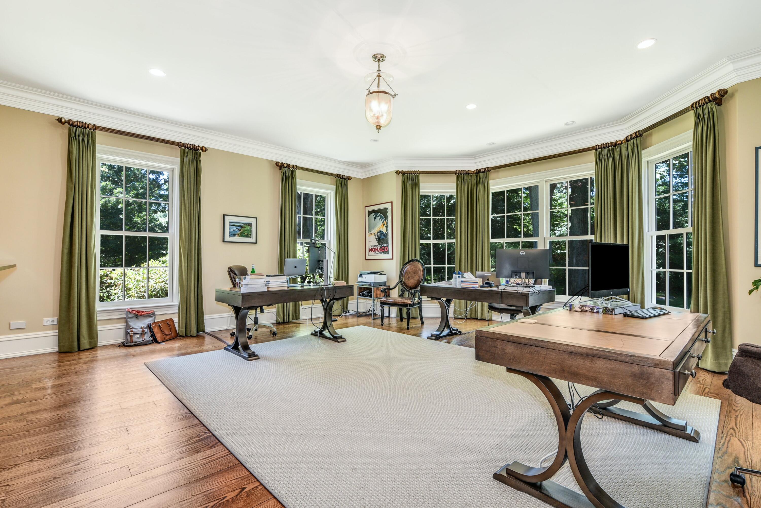 910 Smith Ridge Road New Canaan, CT 06840 - Photo 9 of 40 a living room with furniture and large windows