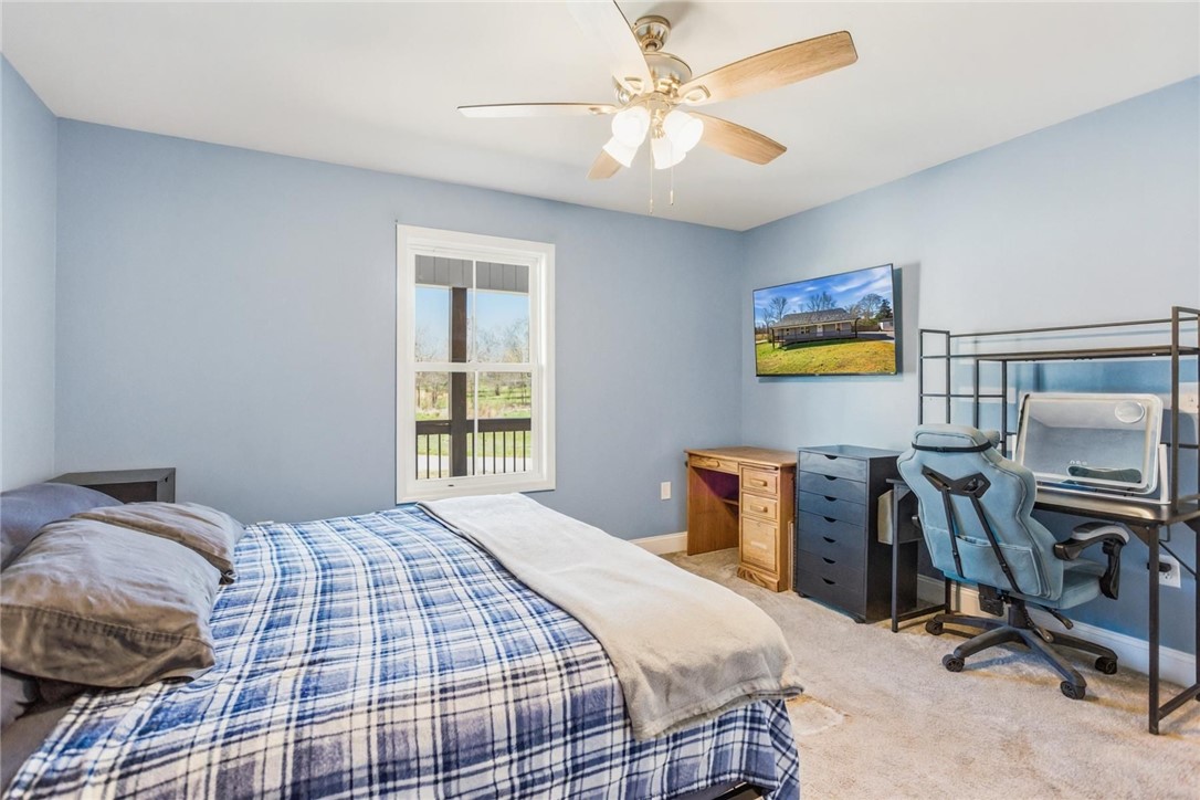 745 Dave Nix Road Seneca, SC 29678 - Photo 19 of 23 A window-filled bedroom with a soothing color palette, offering a peaceful retreat.