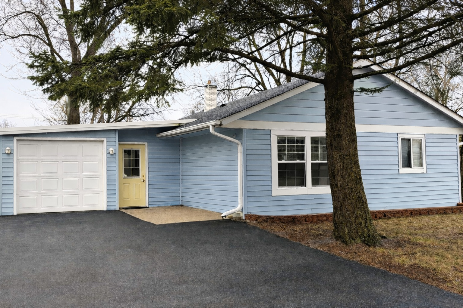11 Helm Road Carpentersville, IL 60110 - Photo 1 of 8 a front view of a house with a yard and garage