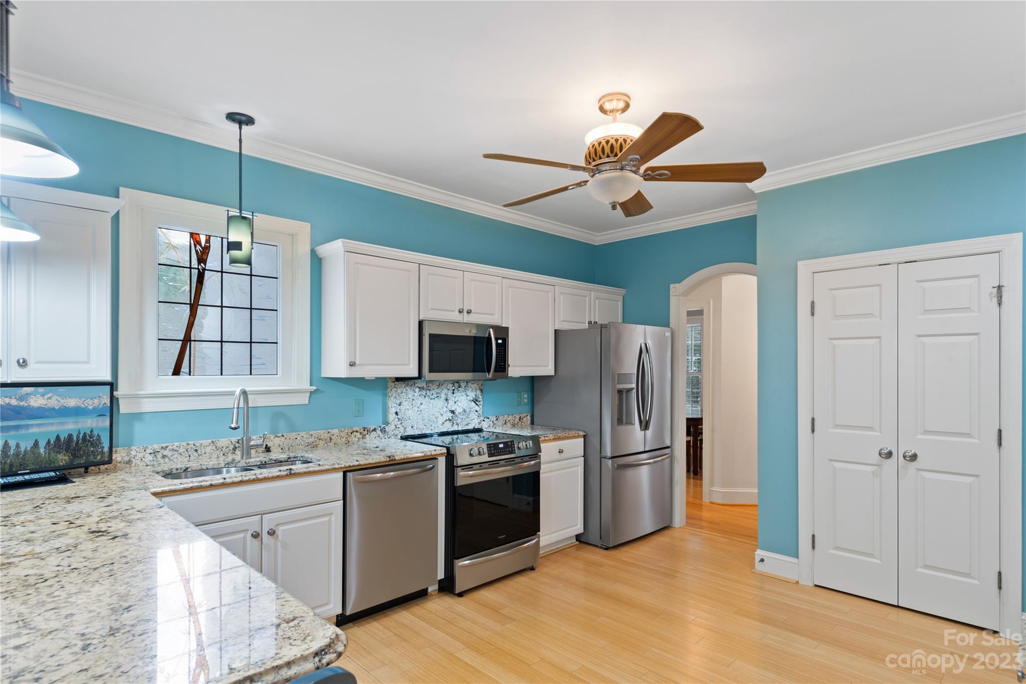 7604 Bosham Lane Charlotte, NC 28270 - Photo 11 of 39 a kitchen with stainless steel appliances granite countertop a refrigerator a stove a sink and a microwave