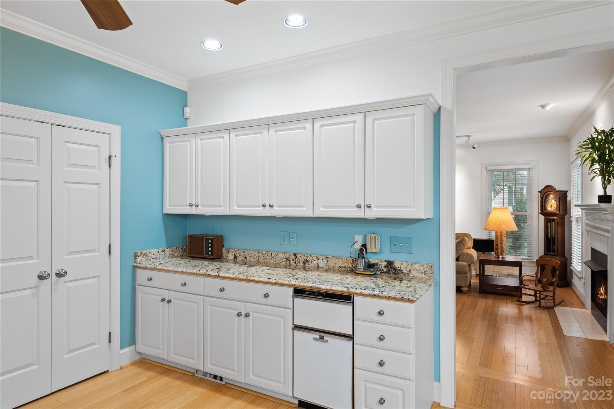 7604 Bosham Lane Charlotte, NC 28270 - Photo 15 of 39 a kitchen with granite countertop a sink cabinets and wooden floor