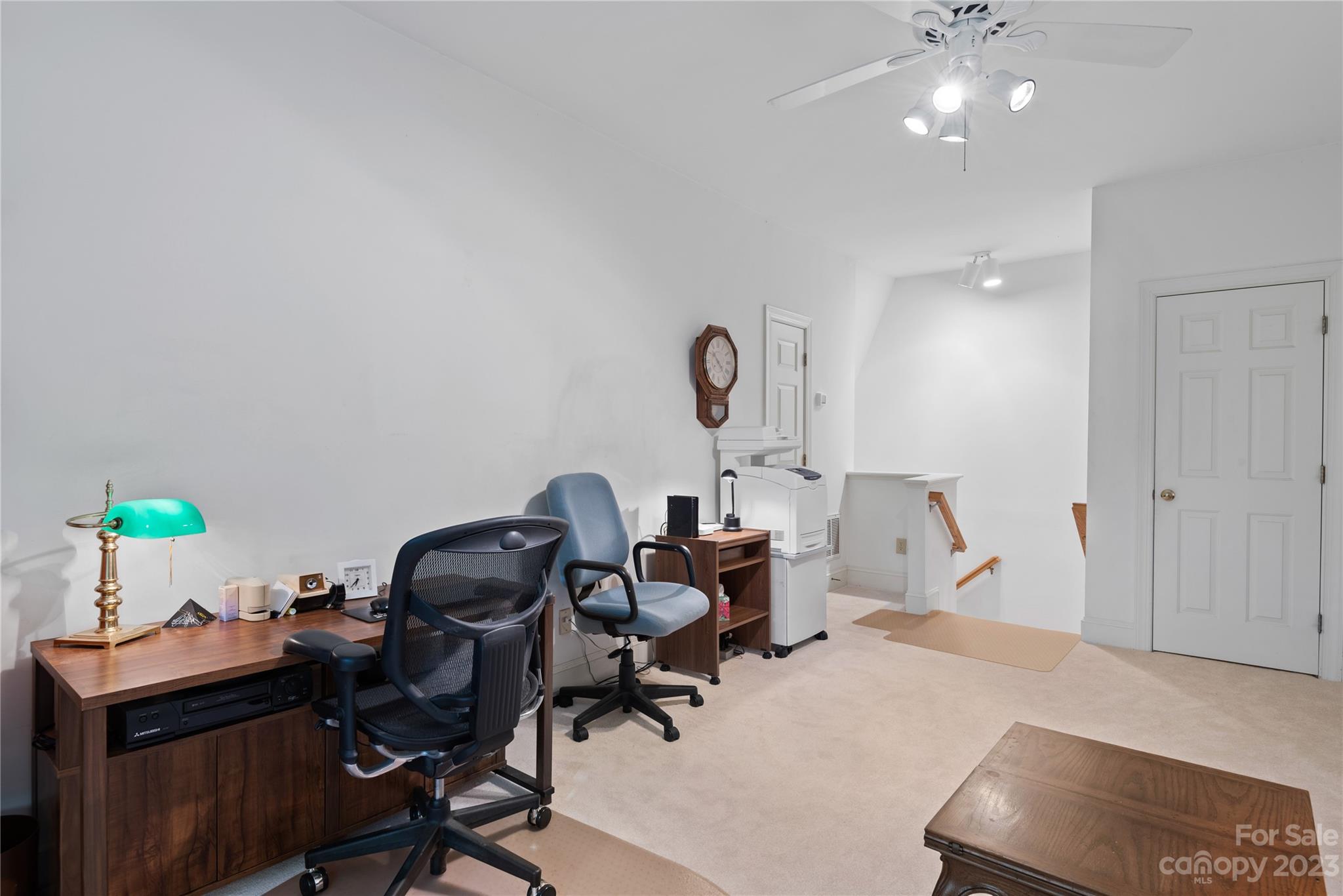 7604 Bosham Lane Charlotte, NC 28270 - Photo 19 of 39 a view of a workspace with furniture and a chandelier