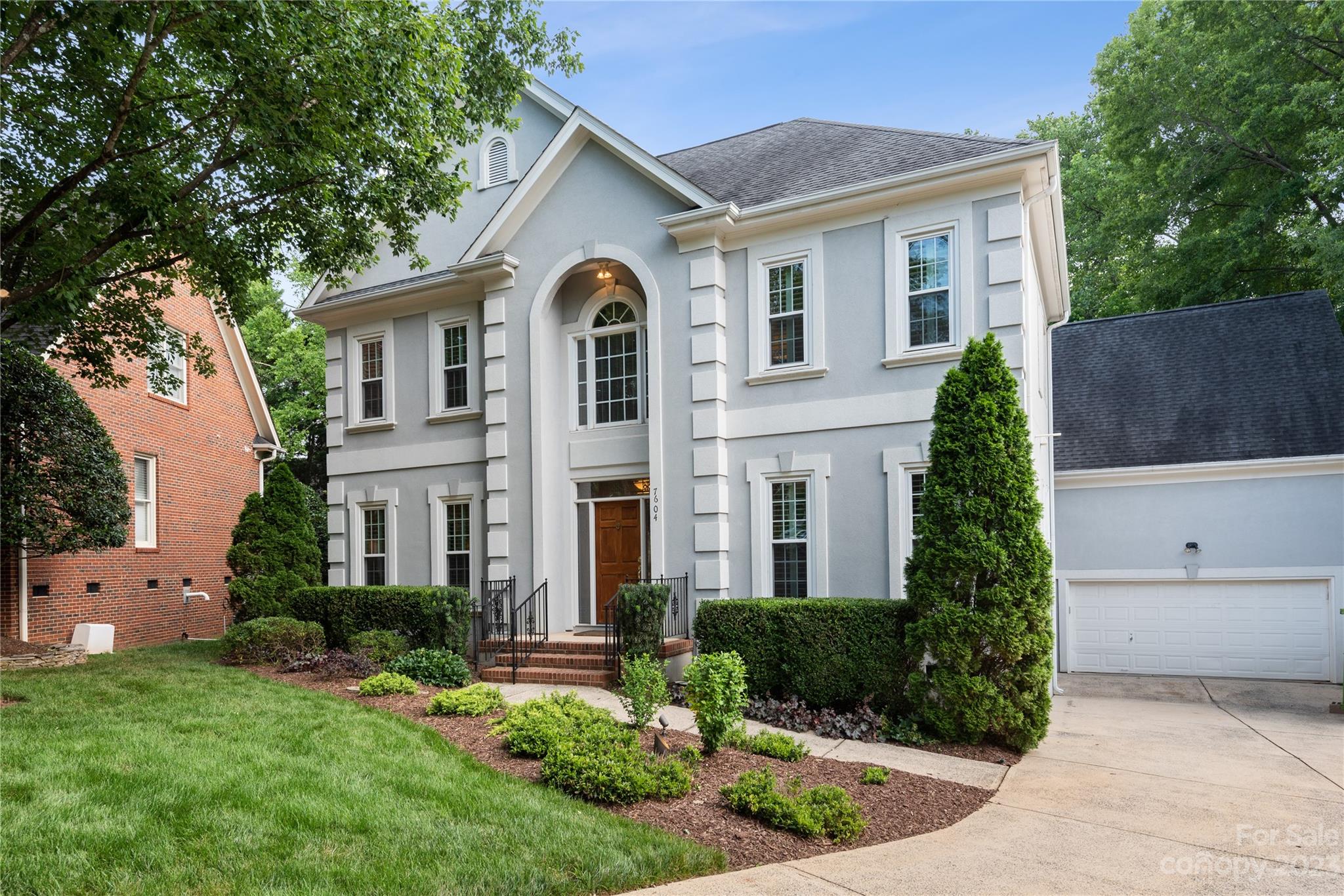 7604 Bosham Lane Charlotte, NC 28270 - Photo 2 of 39 a front view of a house with a yard