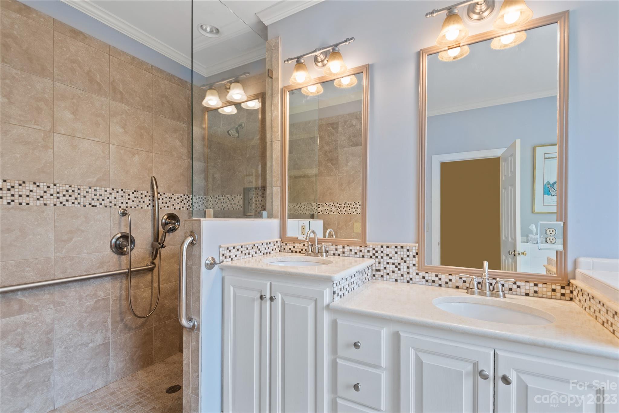 7604 Bosham Lane Charlotte, NC 28270 - Photo 22 of 39 a bathroom with a double vanity sink mirror and shower