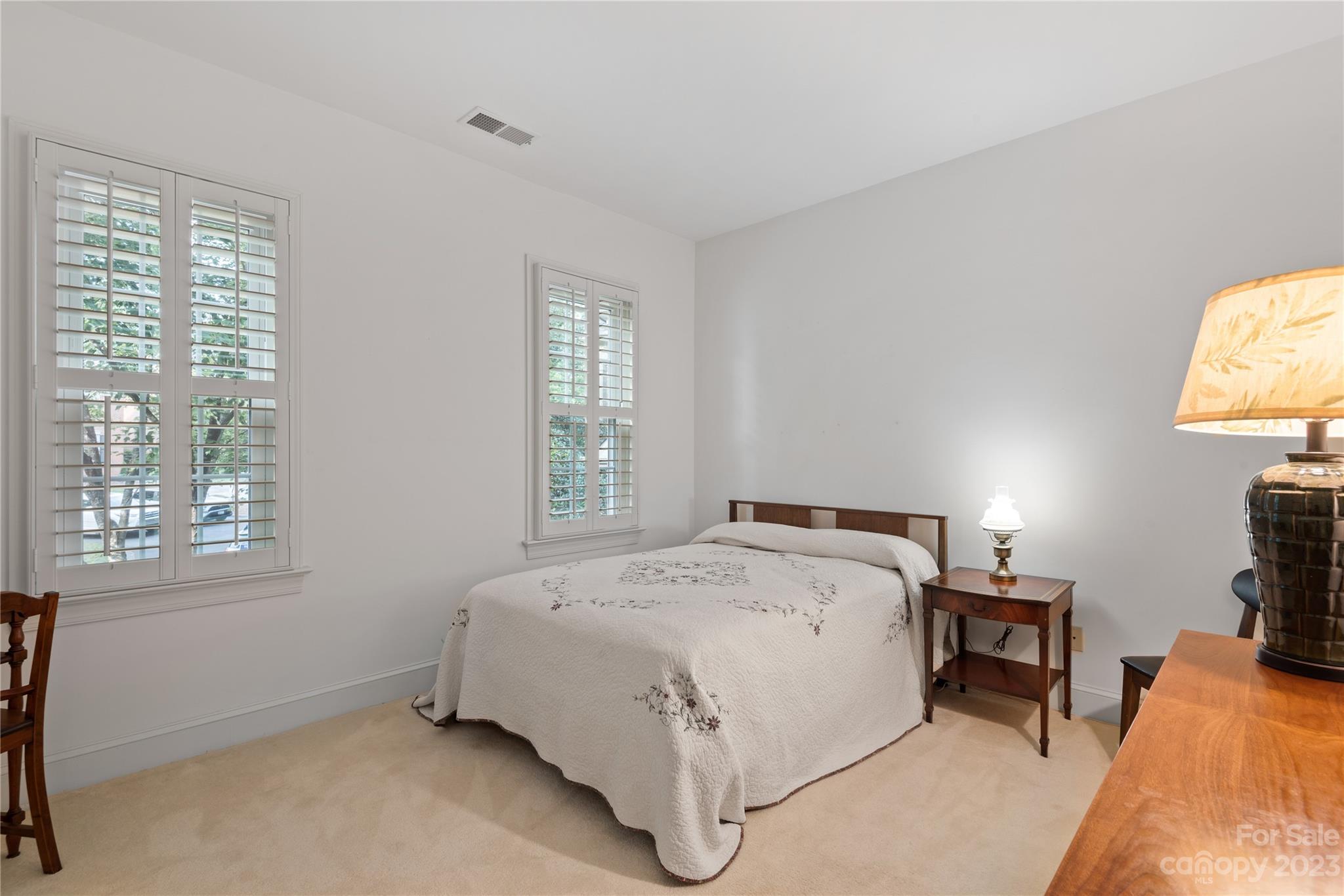 7604 Bosham Lane Charlotte, NC 28270 - Photo 24 of 39 a bedroom with a bed and a window
